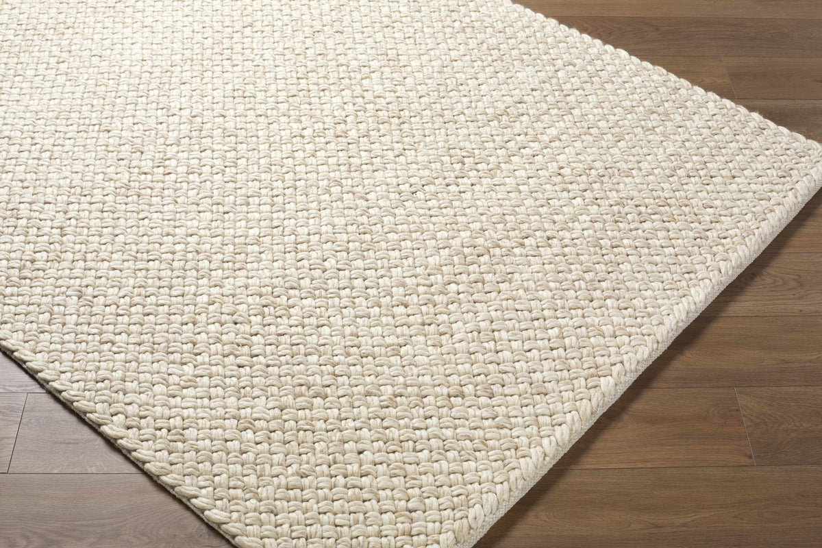 Rowue Ivory Solid Hand Woven Wool Area Rug