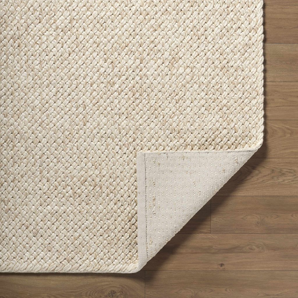 Rowue Ivory Solid Hand Woven Wool Area Rug