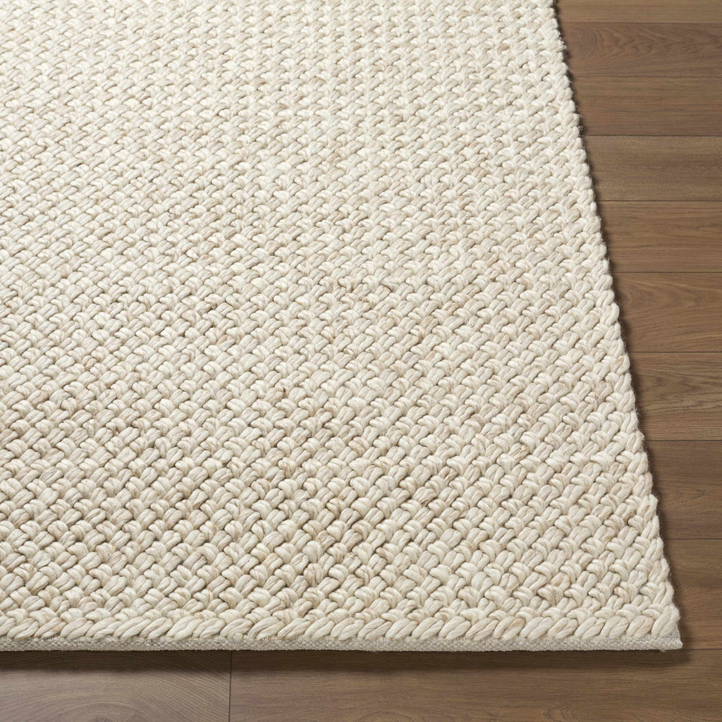 Rowue Ivory Solid Hand Woven Wool Area Rug