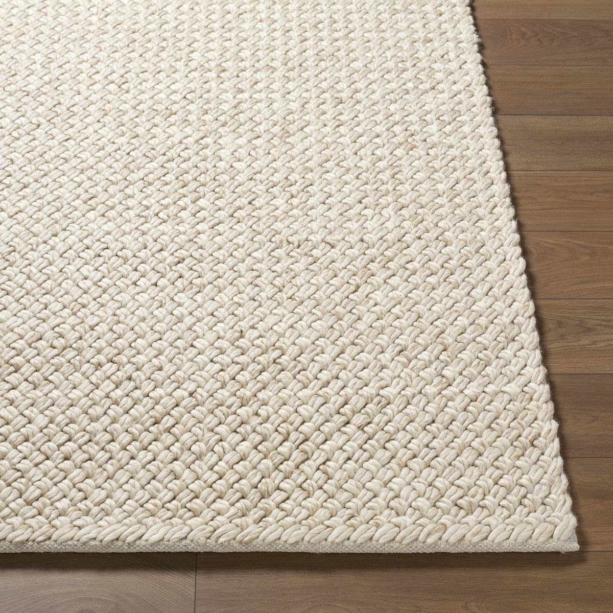 Rowue Ivory Solid Hand Woven Wool Area Rug
