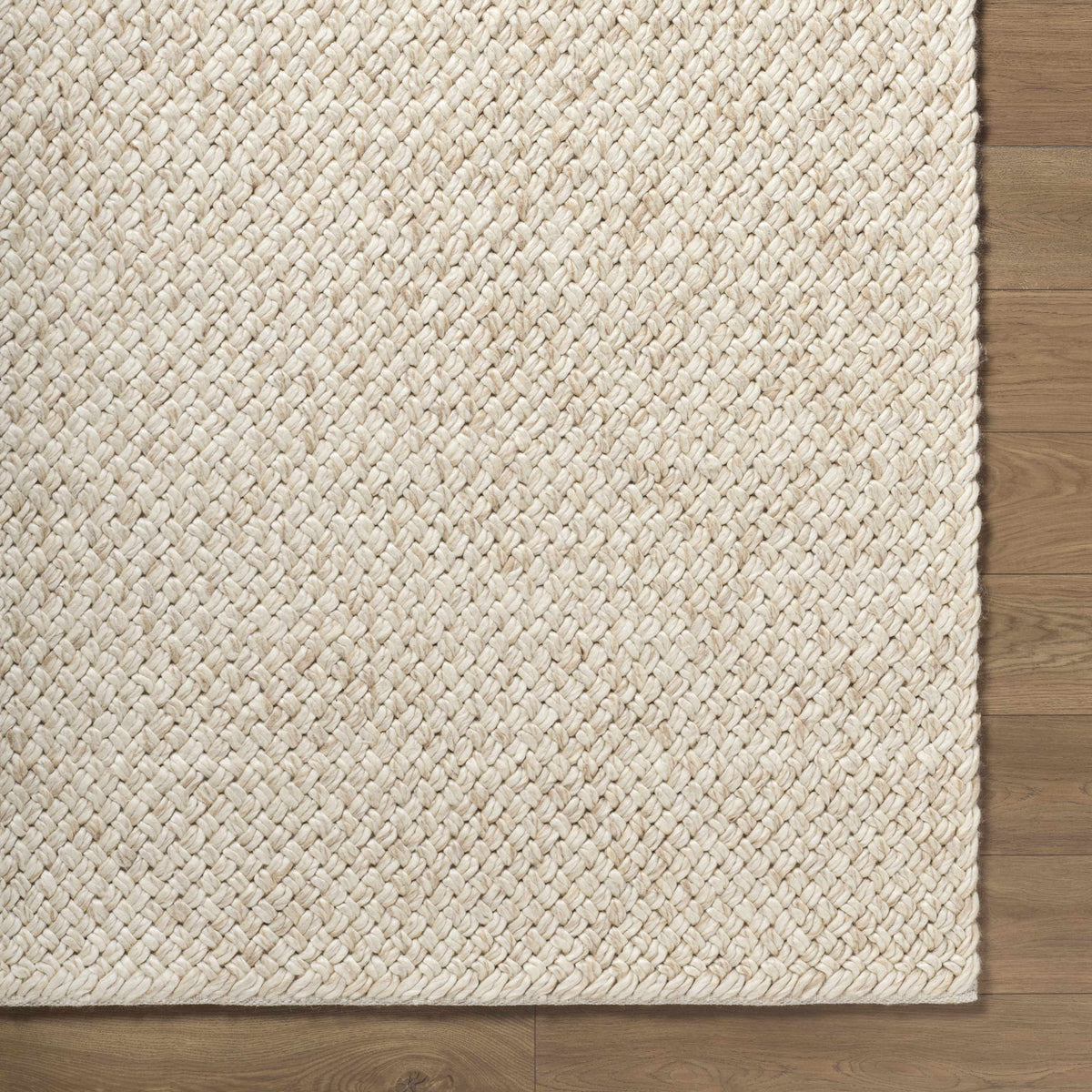 Rowue Ivory Solid Hand Woven Wool Area Rug