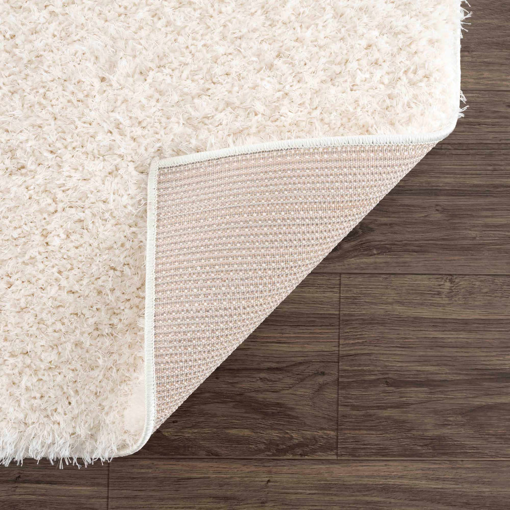 Faina Solid Cream Shag Washable Area Rug