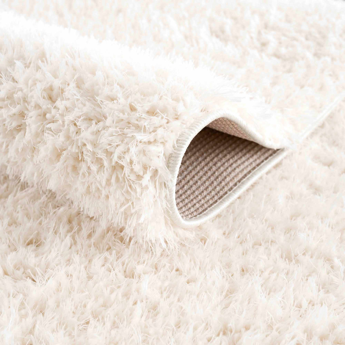 Faina Solid Cream Shag Washable Area Rug