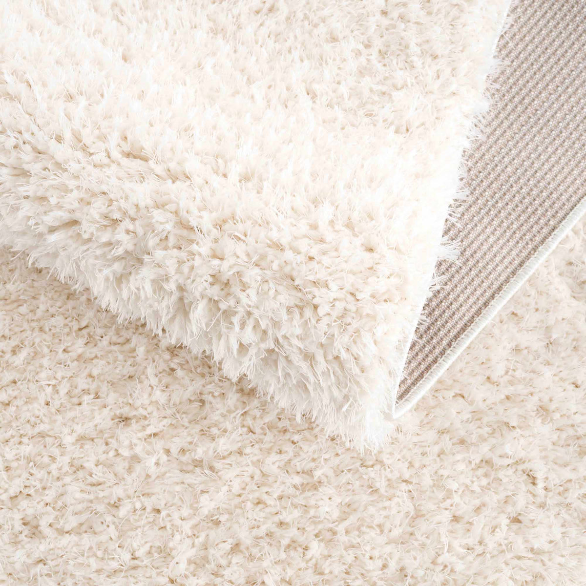 Faina Solid Cream Shag Washable Area Rug