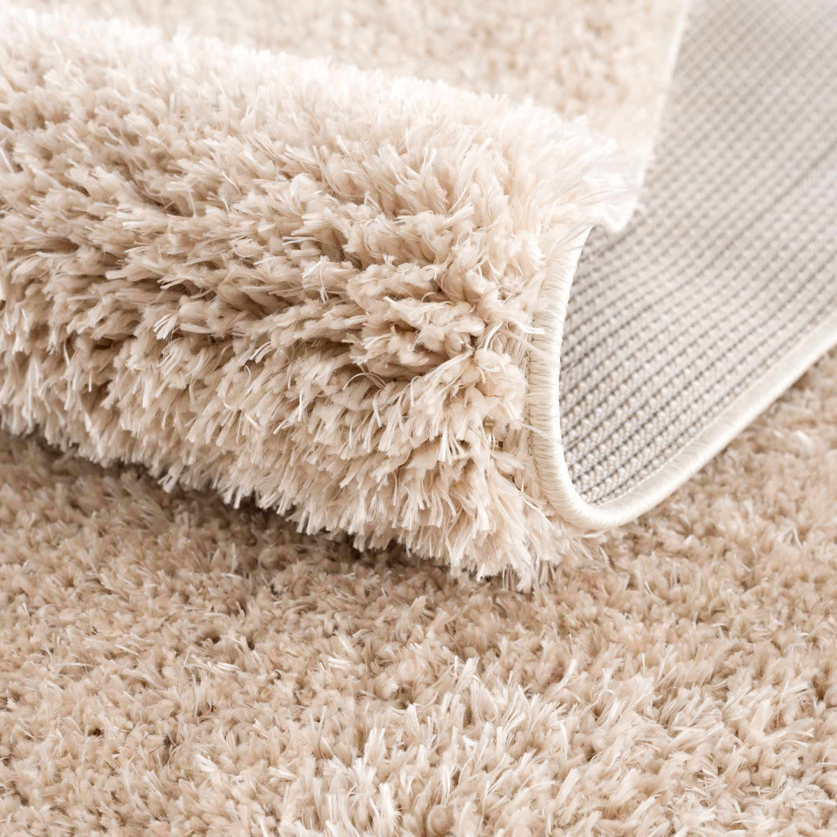 Faina Solid Beige Shag Washable Area Rug - Clearance