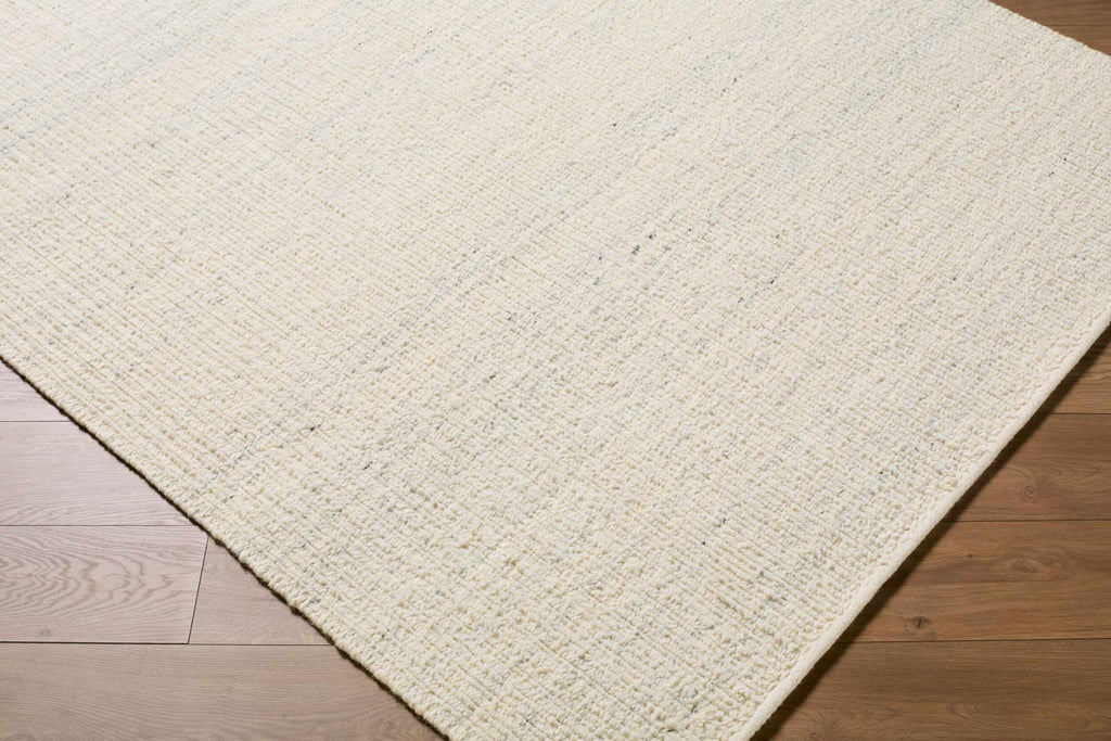 Padoo Ivory Solid Hand Woven Wool Area Rug