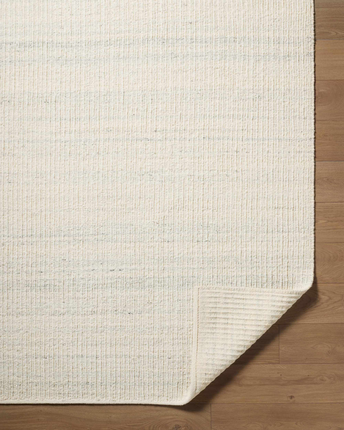 Padoo Ivory Solid Hand Woven Wool Area Rug