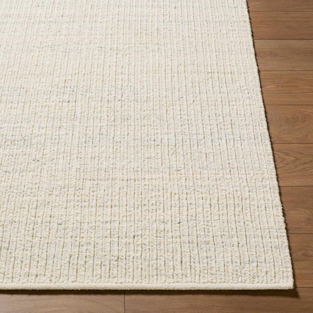 Padoo Ivory Solid Hand Woven Wool Area Rug
