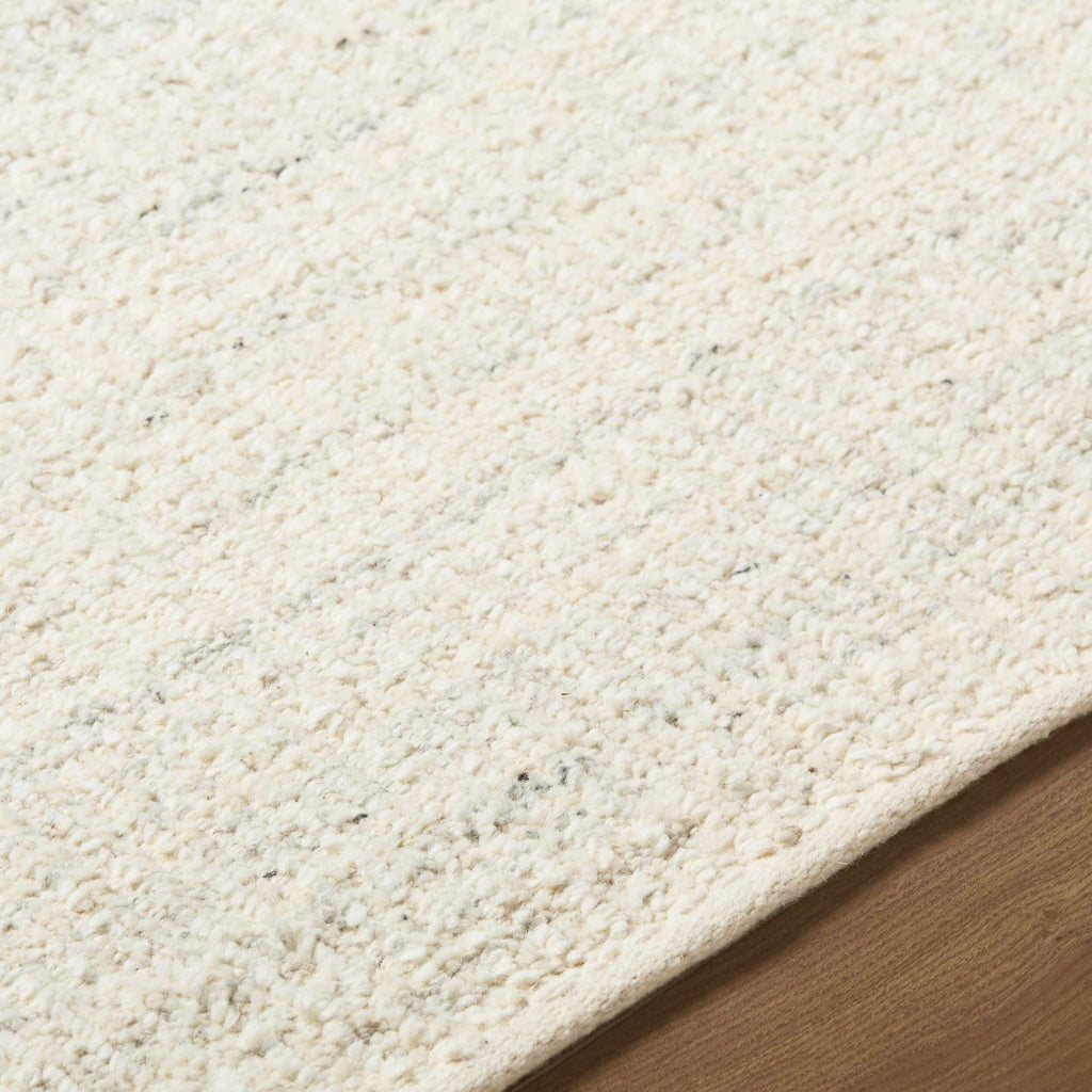 Padoo Ivory Solid Hand Woven Wool Area Rug