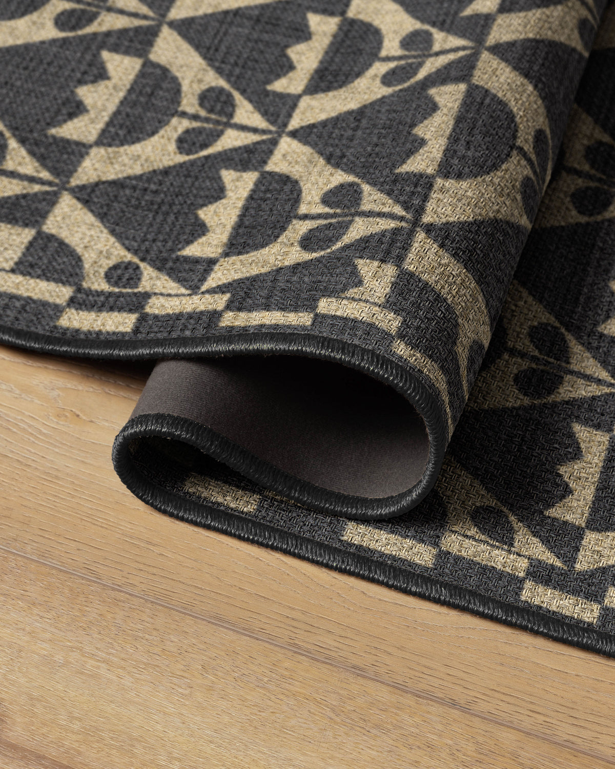 Tulip Heaven Black & Natural Re-Jute Rug by Dan Pelosi